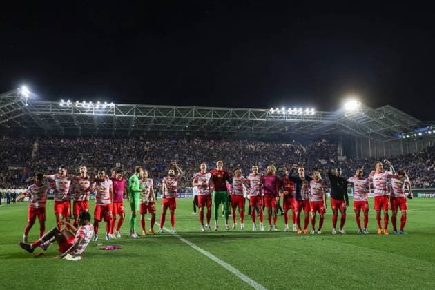 Bergamo, Italy, 14th April 2022. RB Leipzig players celebrate in front of their fans following the final whistle of the UEFA Europa League match at Gewiss Stadium, Bergamo. Picture credit should read: Jonathan Moscrop Sportimage EDITORIAL USE ONLY. No use with unauthorised audio, video, data, fixture lists, club league logos or live services. Online in-match use limited to 120 images, no video emulation. No use in betting, games or single club league player publications. SPI-1637-0020