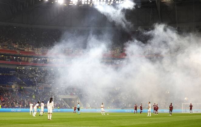 Mandatory Credit: Photo by Simon Dael Shutterstock (12893327aj) West Ham United and Lyon players before kick off Olympique Lyonnais v West Ham United, UEFA Europa League, Quarter Final, Second Leg, Football, Groupama Stadium, Lyon, France - 14 Apr 2022 EDITORIAL USE ONLY No use with unauthorised audio, video, data, fixture lists, club league logos or live services. Online in-match use limited to 120 images, no video emulation. No use in betting, games or single club league player publications. Olympique Lyonnais v West Ham United, UEFA Europa League, Quarter Final, Second Leg, Football, Groupama Stadium, Lyon, France - 14 Apr 2022 EDITORIAL USE ONLY No use with unauthorised audio, video, data, fixture lists, club league logos or live services. Online in-match use limited to 120 images, no video emulation. No use in betting, games or single club league player publications. Copyright: xSimonxDael Shutterstockx 12893327aj