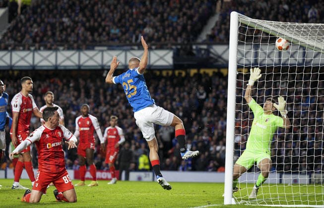 Mandatory Credit: Photo by Stuart Wallace Shutterstock (12893325at) Kemar Roofe of Rangers heads against the crossbar with SC Braga goalkeeper Matheus beaten. Rangers v Braga, UEFA Europa League, Quarter Final, Second Leg, Football, Ibrox Stadium, Glasgow, UK - 14 Apr 2022 EDITORIAL USE ONLY No use with unauthorised audio, video, data, fixture lists, club league logos or live services. Online in-match use limited to 120 images, no video emulation. No use in betting, games or single club league player publications. Rangers v Braga, UEFA Europa League, Quarter Final, Second Leg, Football, Ibrox Stadium, Glasgow, UK - 14 Apr 2022 EDITORIAL USE ONLY No use with unauthorised audio, video, data, fixture lists, club league logos or live services. Online in-match use limited to 120 images, no video emulation. No use in betting, games or single club league player publications.  Copyright: xStuartxWallace Shutterstockx 12893325at