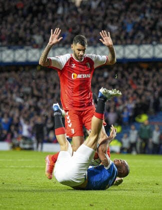 Mandatory Credit: Photo by Stuart Wallace Shutterstock (12893325ay) Kemar Roofe of Rangers fouled inside the penalty area by Vitor Tormena of SC Braga. Rangers v Braga, UEFA Europa League, Quarter Final, Second Leg, Football, Ibrox Stadium, Glasgow, UK - 14 Apr 2022 EDITORIAL USE ONLY No use with unauthorised audio, video, data, fixture lists, club league logos or live services. Online in-match use limited to 120 images, no video emulation. No use in betting, games or single club league player publications. Rangers v Braga, UEFA Europa League, Quarter Final, Second Leg, Football, Ibrox Stadium, Glasgow, UK - 14 Apr 2022 EDITORIAL USE ONLY No use with unauthorised audio, video, data, fixture lists, club league logos or live services. Online in-match use limited to 120 images, no video emulation. No use in betting, games or single club league player publications.  Copyright: xStuartxWallace Shutterstockx 12893325ay