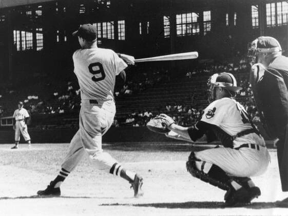 CLEVELAND, OH - 1947: Ted Williams takes a swing at a pitch during a game in 1947 at Cleveland s Municipal Stadium. The catcher for the Indians is Al Lopez, in this first photo in a sequence. MLB, Baseball Herren, USA Archive Icon208543165