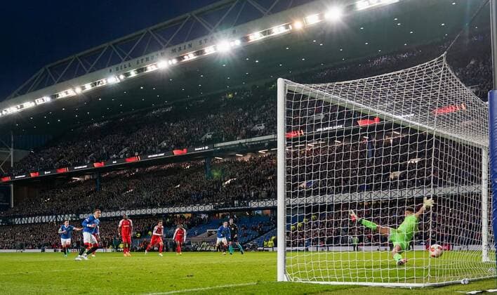 Mandatory Credit: Photo by Stuart Wallace Shutterstock (12893325bx) Rangers Captain James Tavernier beats SC Braga goalkeeper Matheus from the penalty spot to give Rangers a 1-0 lead (agg. 1-1). Rangers v Braga, UEFA Europa League, Quarter Final, Second Leg, Football, Ibrox Stadium, Glasgow, UK - 14 Apr 2022 EDITORIAL USE ONLY No use with unauthorised audio, video, data, fixture lists, club league logos or live services. Online in-match use limited to 120 images, no video emulation. No use in betting, games or single club league player publications. Rangers v Braga, UEFA Europa League, Quarter Final, Second Leg, Football, Ibrox Stadium, Glasgow, UK - 14 Apr 2022 EDITORIAL USE ONLY No use with unauthorised audio, video, data, fixture lists, club league logos or live services. Online in-match use limited to 120 images, no video emulation. No use in betting, games or single club league player publications.  Copyright: xStuartxWallace Shutterstockx 12893325bx