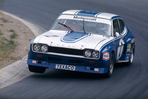 Hans Heyer treibt den Werks Wagen Capri RS 2600 von Ford sehenswert über den Nürburgring Adenauer Forst im Int. ADAC - Eifelrennen 1973 *** Hans Heyer drives the factory car Capri RS 2600 from Ford over the Nürburgring Adenauer Forst in the Int ADAC Eifelrennen 1973.