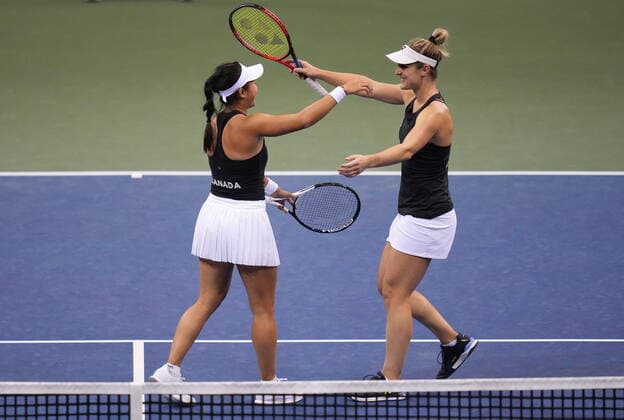 April 16, 2022, VANCOUVER, BC, CANADA: Canada s Carol Zhao, left, and Gabriela Dabrowski celebrate after defeating Latvia s Daniela Vismane and Darja Semenistaja during a Billie Jean King Cup qualifier doubles tennis match, in Vancouver, on Saturday, April 16, 2022. Canada News - April 16, 2022 - ZUMAc35_ 20220416_zaf_c35_133 Copyright: xDarrylxDyckx