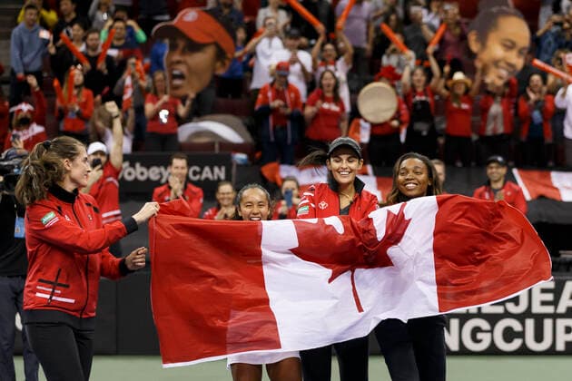 April 16, 2022, Vancouver, British Columbia, Canada: VANCOUVER, BRITISH COLUMBIA - APRIL 16: (L-R) REBECCA MARINO, LEYLAH ANNIE FERNANDEZ, Team Captain HEIDI EL TABAKH and FRANCOISE ABANDA celebrates after defeating DANIELA VISMANE of Latvia during the Billie Jean King Cup Qualifier singles tennis match at Pacific Coliseum in Vancouver, British Columbia, Canada. Vancouver Canada - ZUMAc132 20220416_zap_c132_020 Copyright: xAndrewxChinx
