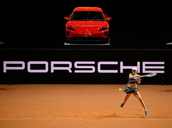 Iga Swiatek POL action in front of winning car Porsche Taycan GTS LOGO perimeter advertising tennis ladies Porsche Cup Porsche Tennis Grand Prix GP Stuttgart 2022 Porsche Arena 20 04 2022 DFL REGULATES PROHIBIT ANY USE OF PHOTOGRAPHS AS IMAGE SEQUENCES AND OR QUASI VIDEO Porsche Tennis Grand Prix GP Stuttgart 2022