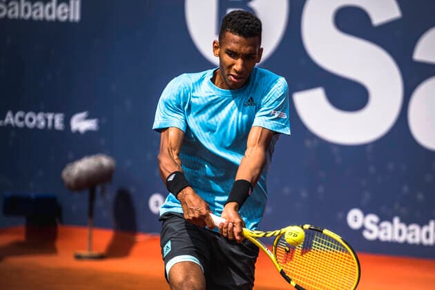 April 22, 2022, Barcelona, Catalonia, Spain: FELIX AUGER-ALIASSIME (CAN) returns the ball to Frances Tiafoe (USA) at Day 5 of the Barcelona Open Banc Sabadell 2022 Barcelona Spain - ZUMAo105 20220422_zap_o105_002 Copyright: xMatthiasxOesterlex