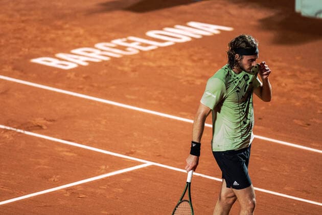 (220423) -- BARCELONA, April 23, 2022 -- Greece s Stefanos Tsitsipas reacts during the men s singles match against Spain s Carlos Alcaraz at Barcelona Open ATP, Tennis Herren 500 series tournament in Barcelona, Spain on April 22, 2022. (Photo by Joan Gosa Xinhua) (SP)SPAIN-BARCELONA-TENNIS-BARCELONA OPEN-MEN S SINGLES MengxDingbo 