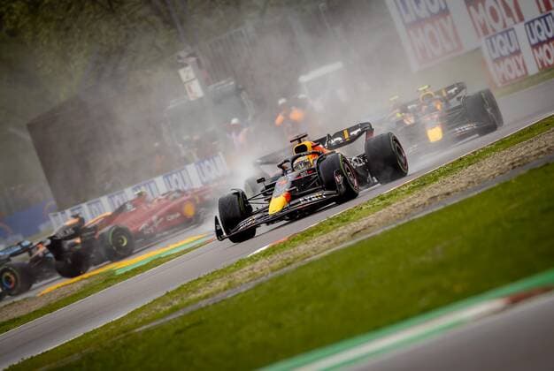 IMOLA Max Verstappen 1 with the Oracle Red Bull Racing RB18 Honda on the track, with Carlos Sainz 55 in the background with the Ferrari sliding off the track during the F1 Grand Prix of Emilia Romagna at Autodromo Enzo e Dino Ferrari on April 24, 2022 in Imola, Italy REMKO DE WAAL GP Emilia Romagna 2022 RACE 2022 xVIxANPxSportx xxANPxIVx 447555272 originalFilename: 447555272.jpg