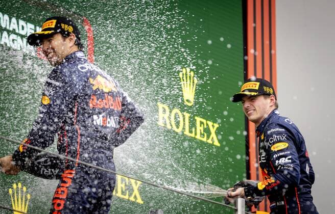 IMOLA Sergio Perez 11 and Max Verstappen 1 of Oracle Red Bull Racing on the podium after winning the Emilia Romagna F1 Grand Prix at Autodromo Enzo e Dino Ferrari on April 24, 2022 in Imola, Italy REMKO DE WAAL GP Emilia Romagna 2022 RACE 2022 xVIxANPxSportx xxANPxIVx 447560027 originalFilename: 447560027.jpg
