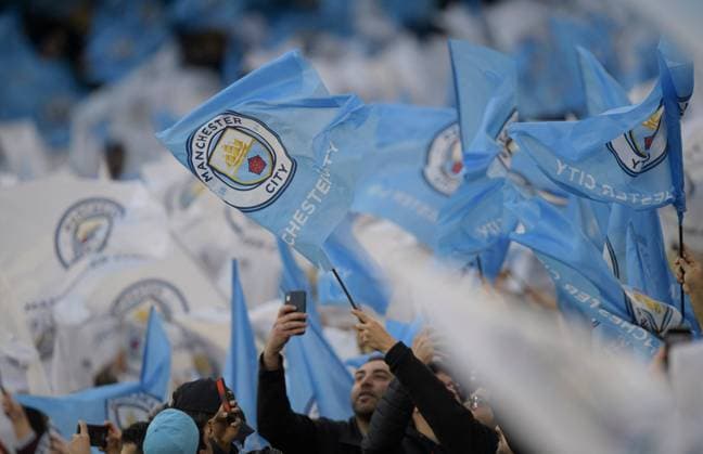 Manchester City v Real Madrid UEFA Champions League Manchester City fans wave flags before the UEFA Champions League Semi Final First Leg match at the Etihad Stadium, Manchester Content Not Available For UK Newspapers Copyright: xRussellxHartx FIL-16850-0048 UK Newspapers OUT