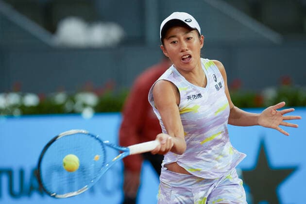(220428) -- MADRID, April 28, 2022 -- Zhang Shuai of China returns the ball during the women s singles 1st round match against Simona Halep of Romania at Madrid Open in Madrid, Spain, April 28, 2022. ) (SP)SPAIN-MADRID-TENNIS-MUTUA MADRID OPEN MengxDingbo 