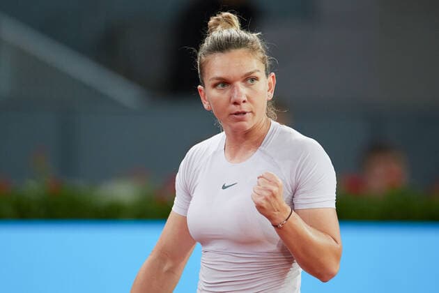 (220428) -- MADRID, April 28, 2022 -- Simona Halep of Romania reacts during the women s singles 1st round match against Zhang Shuai of China at Madrid Open in Madrid, Spain, April 28, 2022. ) (SP)SPAIN-MADRID-TENNIS-MUTUA MADRID OPEN MengxDingbo 