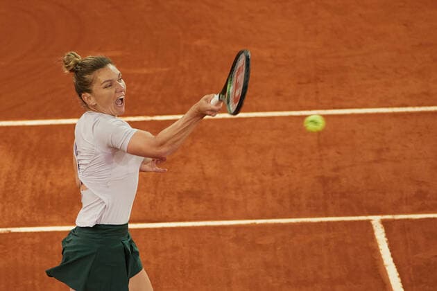 (220428) -- MADRID, April 28, 2022 -- Simona Halep of Romania returns the ball during the women s singles 1st round match against Zhang Shuai of China at Madrid Open in Madrid, Spain, April 28, 2022. ) (SP)SPAIN-MADRID-TENNIS-MUTUA MADRID OPEN MengxDingbo 