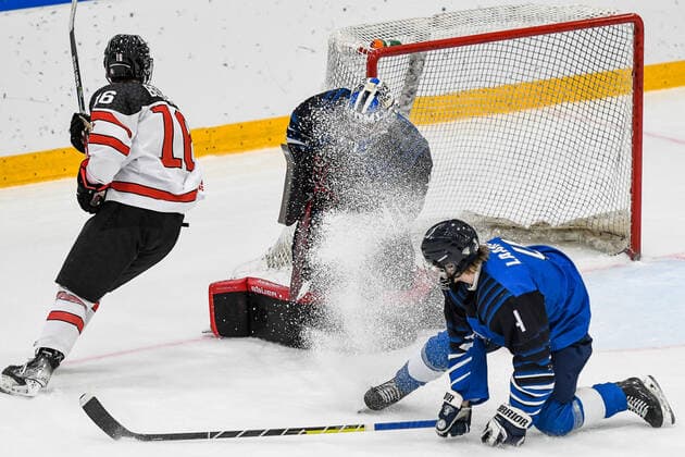 IIHF Ice Hockey U18 World Championship 2022, Finland FIN vs Canada CAN 28 04 2022, Erdgas Schwaben Arena, Kaufbeuren, IIHF Ice Hockey U18 World Championship 2022, Finland FIN vs Canada CAN , in picture Connor Bedard CAN, 16 , Topias Leinonen FIN, 1 is dusted by Elmeri Laakso FIN, 4 nordphotoxGmbHx xHafner nph00200