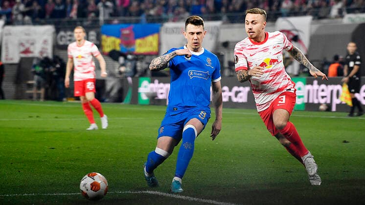 Soccer UEFA Europa League, semi-final, first leg season 2021 2022, RB Leipzig vs Glasgow Rangers 28 04 2022 Duel for the ball between Ryan Jack Central midfield Glasgow Rangers, back number 8 left and Angelino Left defender RB Leipzig, back number 3, 3 right during the match RB Leipzig vs Glasgow Rangers 28 04 2022 Leipzig Saxony Germany Red Bull Arena