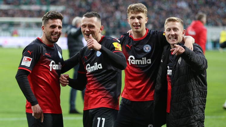 f l Ahmet Arslan Holstein Kiel, 7 , Fabian Reese Holstein Kiel, 11 , Jann Fiete Arp Holstein Kiel, 20 and Lewis Holtby Holstein Kiel, 10 with jubilation about the victory, joy about the won game , THE DFL DIRECTIVES PROHIBIT ANY USE OF PHOTOGRAPHS AS IMAGE SEQUENCES AND OR VIDEOA HNUAL PHOTOSTRACKS DFL REGULATES PROHIBIT ANY USE OF PHOTOGRAPHS AS IMAGE SEQUENCES AND OR QUASI VIDEO , 29 04 2022, Bremen Germany , Football, 2 Bundesliga, SV Werder Bremen Holstein Kiel xobx