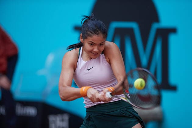 (220430) -- MADRID, April 30, 2022 -- Emma Raducanu of Great Britain returns the ball during the women s singles 1st round match against Tereza Martincova of the Czech Republic at Madrid Open in Madrid, Spain, April 29, 2022. ) (SP)SPAIN-MADRID-TENNIS-MUTUA MADRID OPEN MengxDingbo 