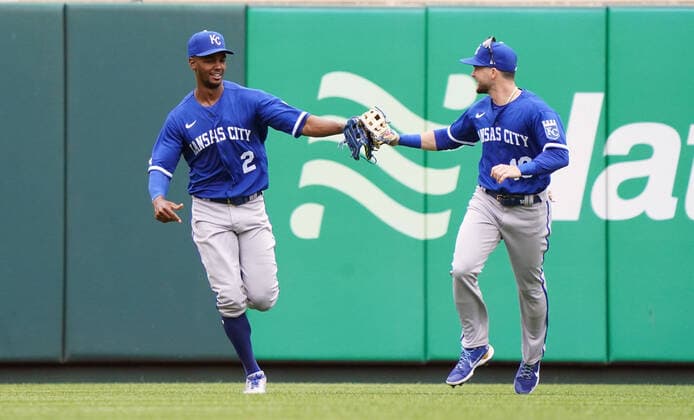 Kansas City Royals Centerfielder Michael A. Taylor (L) is congratulated by teammate Andrew Benintendi after Taylor climbed the wall to take away a home run from St. Louis Cardinals Andrew Knizner in the fifth inning at Busch Stadium in St. Louis on Monday, May 2, 2022. St. Louis defeated Kansas City, 1-0.  SLP2022050208 BILLxGREENBLATT