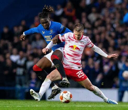 Mandatory Credit: Photo by Luke Nickerson Rangers FC Shutterstock (12926015t) Rangers Defender Calvin Bassey tackles RB Leipzig Midfielder Dani Olmo Rangers v RB Leipzig, UEFA Europa League, Semi Final, Second Leg, Football, Ibrox Stadium, Glasgow, UK - 05 May 2022 EDITORIAL USE ONLY No use with unauthorised audio, video, data, fixture lists, club league logos or live services. Online in-match use limited to 120 images, no video emulation. No use in betting, games or single club league player publications. Rangers v RB Leipzig, UEFA Europa League, Semi Final, Second Leg, Football, Ibrox Stadium, Glasgow, UK - 05 May 2022 EDITORIAL USE ONLY No use with unauthorised audio, video, data, fixture lists, club league logos or live services. Online in-match use limited to 120 images, no video emulation. No use in betting, games or single club league player publications.  Copyright: xLukexNickerson RangersxFC Shutterstockx 12926015t