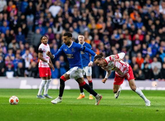 Mandatory Credit: Photo by Luke Nickerson Rangers FC Shutterstock (12926015x) Rangers Defender Connor Goldson wins the ball from RB Leipzig Forward Yussuf Poulsen Rangers v RB Leipzig, UEFA Europa League, Semi Final, Second Leg, Football, Ibrox Stadium, Glasgow, UK - 05 May 2022 EDITORIAL USE ONLY No use with unauthorised audio, video, data, fixture lists, club league logos or live services. Online in-match use limited to 120 images, no video emulation. No use in betting, games or single club league player publications. Rangers v RB Leipzig, UEFA Europa League, Semi Final, Second Leg, Football, Ibrox Stadium, Glasgow, UK - 05 May 2022 EDITORIAL USE ONLY No use with unauthorised audio, video, data, fixture lists, club league logos or live services. Online in-match use limited to 120 images, no video emulation. No use in betting, games or single club league player publications.  Copyright: xLukexNickerson RangersxFC Shutterstockx 12926015x