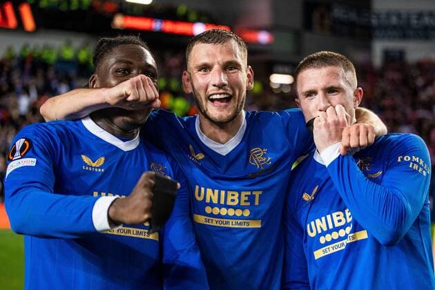 Mandatory Credit: Photo by Kirk O Rourke Rangers FC Shutterstock (12926021bp) Calvin Bassey, Borna Barisic and John Lundstram celebrate with the black arm band in memory of hitman Jimmy Bell at the end of the Europa League Semi Final match against RB Leipzig at Ibrox Stadium, Glasgow. Rangers v RB Leipzig, UEFA Europa League, Semi Final, Second Leg, Football, Ibrox Stadium, Glasgow, UK - 05 May 2022 EDITORIAL USE ONLY No use with unauthorised audio, video, data, fixture lists, club league logos or live services. Online in-match use limited to 120 images, no video emulation. No use in betting, games or single club league player publications. Rangers v RB Leipzig, UEFA Europa League, Semi Final, Second Leg, Football, Ibrox Stadium, Glasgow, UK - 05 May 2022 EDITORIAL USE ONLY No use with unauthorised audio, video, data, fixture lists, club league logos or live services. Online in-match use limited to 120 images, no video emulation. No use in betting, games or single club league player publications. Copyright: xKirkxO Rourke RangersxFC Shutterstockx 12926021bp