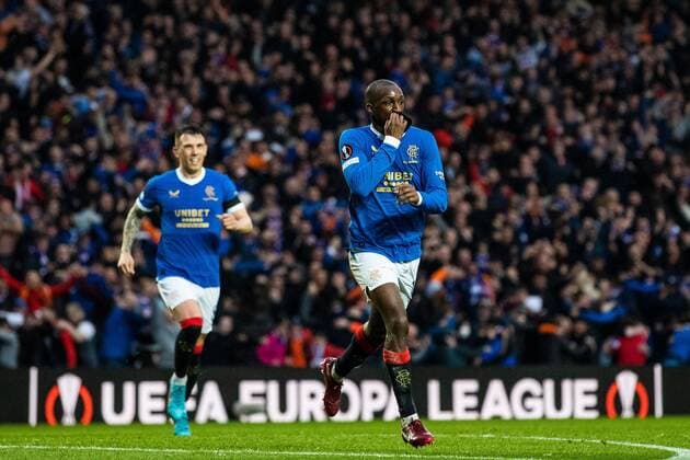 Mandatory Credit: Photo by Kirk O Rourke Rangers FC Shutterstock (12926021er) Glen Kamara of Rangers celebrates his goal and kissing his black arm band in memory of kitman Jimmy Ball during the Europa League Semi Final match against RB Leipzig at Ibrox Stadium, Glasgow. Rangers v RB Leipzig, UEFA Europa League, Semi Final, Second Leg, Football, Ibrox Stadium, Glasgow, UK - 05 May 2022 EDITORIAL USE ONLY No use with unauthorised audio, video, data, fixture lists, club league logos or live services. Online in-match use limited to 120 images, no video emulation. No use in betting, games or single club league player publications. Rangers v RB Leipzig, UEFA Europa League, Semi Final, Second Leg, Football, Ibrox Stadium, Glasgow, UK - 05 May 2022 EDITORIAL USE ONLY No use with unauthorised audio, video, data, fixture lists, club league logos or live services. Online in-match use limited to 120 images, no video emulation. No use in betting, games or single club league player publications. Copyright: xKirkxO Rourke RangersxFC Shutterstockx 12926021er