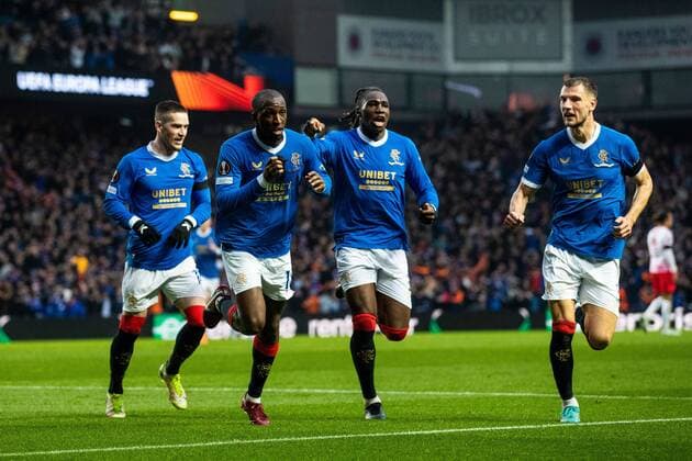 Mandatory Credit: Photo by Kirk O Rourke Rangers FC Shutterstock (12926021ev) Glen Kamara of Rangers celebrates his goal while kissing his black arm band in memory of kitman Jimmy Bell alongside Ryan Kent, Calvin Bassey and Borna Barisic during the Europa League Semi Final match against RB Leipzig at Ibrox Stadium, Glasgow. Rangers v RB Leipzig, UEFA Europa League, Semi Final, Second Leg, Football, Ibrox Stadium, Glasgow, UK - 05 May 2022 EDITORIAL USE ONLY No use with unauthorised audio, video, data, fixture lists, club league logos or live services. Online in-match use limited to 120 images, no video emulation. No use in betting, games or single club league player publications. Rangers v RB Leipzig, UEFA Europa League, Semi Final, Second Leg, Football, Ibrox Stadium, Glasgow, UK - 05 May 2022 EDITORIAL USE ONLY No use with unauthorised audio, video, data, fixture lists, club league logos or live services. Online in-match use limited to 120 images, no video emulation. No use in betting, games or single club league player publications.  Copyright: xKirkxO Rourke RangersxFC Shutterstockx 12926021ev