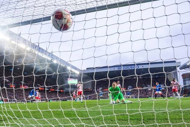 Mandatory Credit: Photo by Kirk O Rourke Rangers FC Shutterstock (12926021fn) Glen Kamara of Rangers scores past RB Leipzig goalkeeper Peter Gulacsi during the Europa League Semi Final match against RB Leipzig at Ibrox Stadium, Glasgow. Rangers v RB Leipzig, UEFA Europa League, Semi Final, Second Leg, Football, Ibrox Stadium, Glasgow, UK - 05 May 2022 EDITORIAL USE ONLY No use with unauthorised audio, video, data, fixture lists, club league logos or live services. Online in-match use limited to 120 images, no video emulation. No use in betting, games or single club league player publications. Rangers v RB Leipzig, UEFA Europa League, Semi Final, Second Leg, Football, Ibrox Stadium, Glasgow, UK - 05 May 2022 EDITORIAL USE ONLY No use with unauthorised audio, video, data, fixture lists, club league logos or live services. Online in-match use limited to 120 images, no video emulation. No use in betting, games or single club league player publications.  Copyright: xKirkxO Rourke RangersxFC Shutterstockx 12926021fn