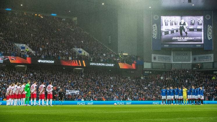 Mandatory Credit: Photo by Kirk O Rourke Rangers FC Shutterstock (12926021gd) Rangers & RB Leipzig players, management and fans during a moment silence for kitman Jimmy Bell during the Europa League Semi Final match against RB Leipzig at Ibrox Stadium, Glasgow. Rangers v RB Leipzig, UEFA Europa League, Semi Final, Second Leg, Football, Ibrox Stadium, Glasgow, UK - 05 May 2022 EDITORIAL USE ONLY No use with unauthorised audio, video, data, fixture lists, club league logos or live services. Online in-match use limited to 120 images, no video emulation. No use in betting, games or single club league player publications. Rangers v RB Leipzig, UEFA Europa League, Semi Final, Second Leg, Football, Ibrox Stadium, Glasgow, UK - 05 May 2022 EDITORIAL USE ONLY No use with unauthorised audio, video, data, fixture lists, club league logos or live services. Online in-match use limited to 120 images, no video emulation. No use in betting, games or single club league player publications.  Copyright: xKirkxO Rourke RangersxFC Shutterstockx 12926021gd