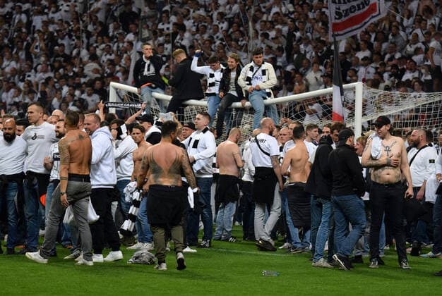 Eintracht Frankfurt fans storm the pitch after their team reached the final in Sevilla photographed on 05 5 2022 in Frankfurt at the Euopa League Pikal soccer match Eintracht Frankfurt vs West Ham United DFL DFB REGULATIONS PROHIBIT ANY USE OF PHOTOGRAPHS as IMAGE SEQUENCES and or QUASI VIDEO