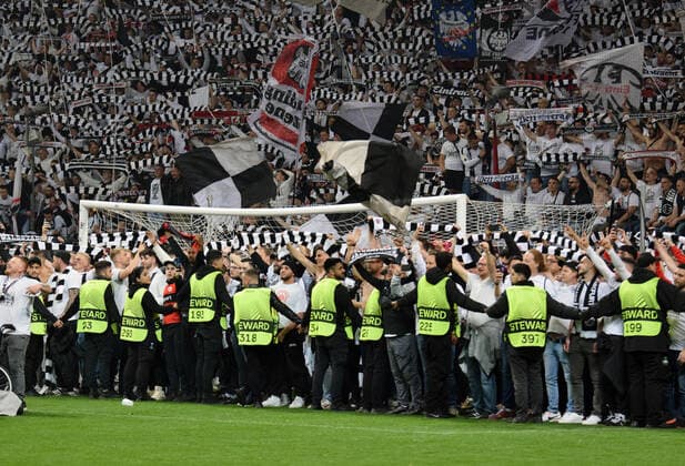 Eintracht Frankfurt fans storm the pitch after their team reached the final in Sevilla photographed on 05 5 2022 in Frankfurt at the Euopa League Pikal soccer match Eintracht Frankfurt vs West Ham United DFL DFB REGULATIONS PROHIBIT ANY USE OF PHOTOGRAPHS as IMAGE SEQUENCES and or QUASI VIDEO