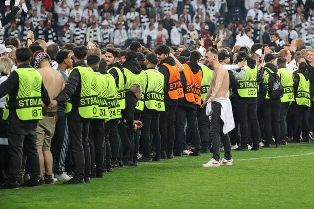 Soccer Europa League semifinal Eintracht Frankfurt West Ham United on 05 05 2022 at Deutsche Bank Park in Frankfurt Stewards push Eintracht Frankfurt fans back into the Nordwestkurve after the storming of the pitch UR