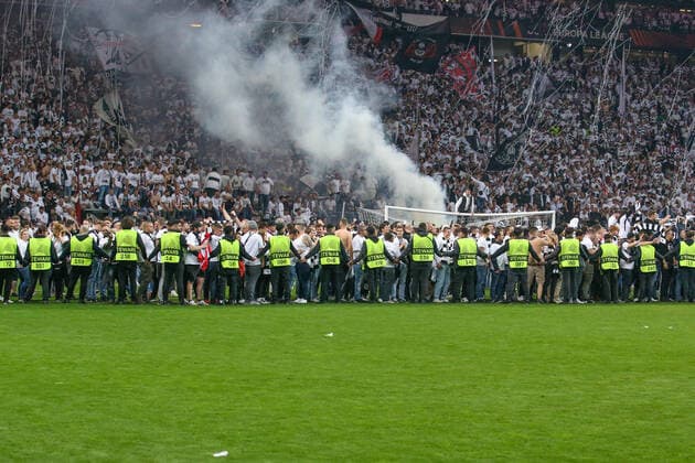 Soccer Europa League semifinal Eintracht Frankfurt West Ham United on 05 05 2022 at Deutsche Bank Park in Frankfurt Stewards push Eintracht Frankfurt fans back into the Nordwestkurve after the storming of the pitch UR