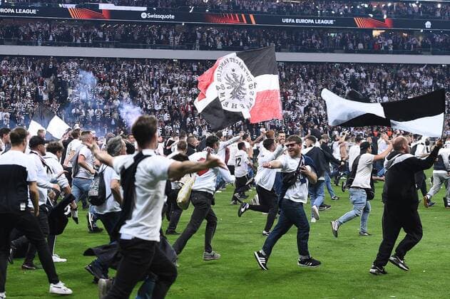 Soccer Europa League semifinal Eintracht Frankfurt West Ham United on 05 05 2022 at Deutsche Bank Park in Frankfurt Platzsturm Fanblock Fans Frankfurt run on the grass after the final whistle and rejoice over the victory and the entry into the Europa League final in Seville xHDx