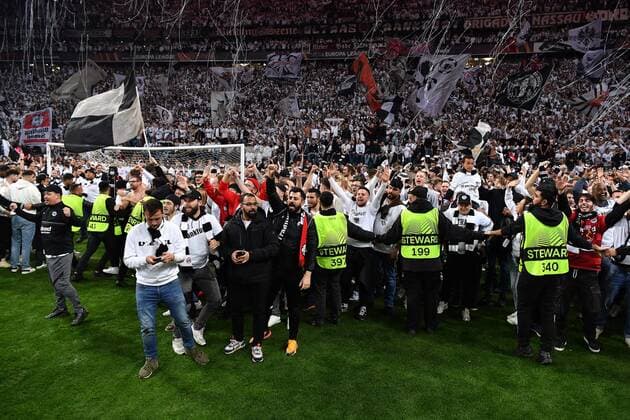 Soccer Europa League semifinal Eintracht Frankfurt West Ham United on 05 05 2022 at Deutsche Bank Park in Frankfurt Platzsturm Fanblock Fans Frankfurt run on the grass after the final whistle and rejoice over the victory and the entry into the Europa League final in Seville xHDx