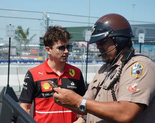 FORMULA 1 CRYPTO COM MIAMI GRAND PRIX 06 05 2022, Miami International Autodrome, Miami, FORMULA 1 CRYPTO COM MIAMI GRAND PRIX ,in the picture Charles Leclerc MCO , Scuderia Ferrari with a policeman nordphotoxGmbHx xBratic nph00250
