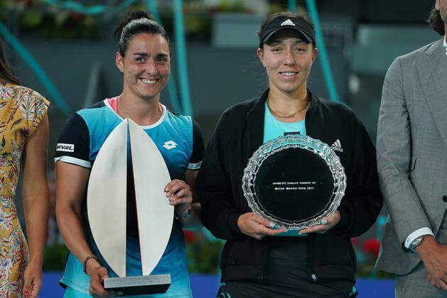 May 8, 2022, Madrid, Spain: Ons Jabeur (L) of Tunisia celebrates with a trophy and Jessica Pegula of the United States, with the runner up trophy following the Women s Singles final match during day ten of Mutua Madrid Open at La Caja Magica. Ons Jabeur beats Jessica Pegula Madrid Spain - ZUMAs197 20220508_zaa_s197_027 Copyright: xAtilanoxGarciax