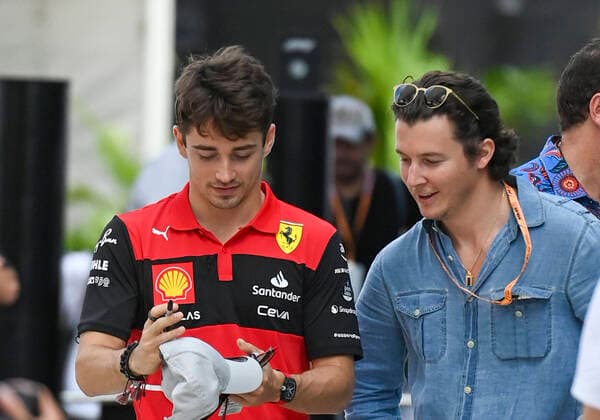8th May 2022; Miami, Florida, USA; Scuderia Ferrari driver Charles Leclerc signs an autograph for a fan as he arrives in the paddock prior to the start of the Formula 1 CRYPTO.COM Miami Grand Prix on May 8, 2022 at Miami International Autodrome in Miami Gardens  ActionPlus12388089 DougxMurray Content restricted for UK based newspaper