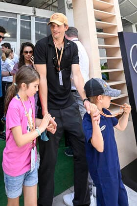 MIAMI GARDENS, FL - MAY 08: Ashton Kutcher and Mila Kunis tour the Mercedes-AMG Petronas hospitality suite with their children prior to the start of the Formula 1 CRYPTO.COM Miami Grand Prix on May 8, 2022 at Miami Autodrome in Miami Gardens, FL. (Photo by Doug Murray Icon Sportswire) AUTO: MAY 08 F1 Crypto.com Miami Grand Prix Icon79620220508026