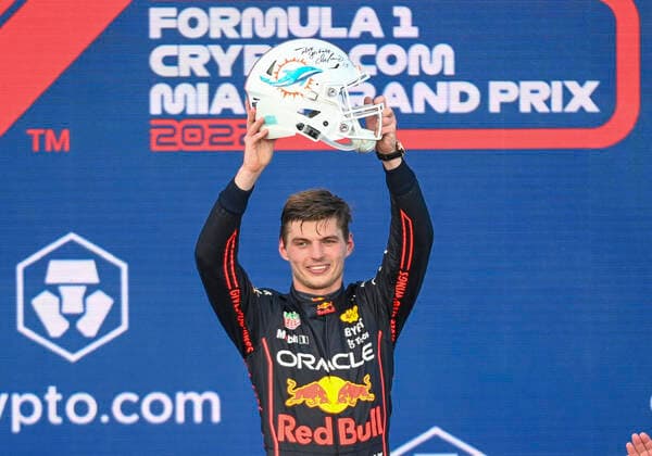 MIAMI GARDENS, FL - MAY 08: Oracle Red Bull driver Max Verstappen holds up an Miami Dolphins NFL, American Football Herren, USA football helmet as he celebrates winning the Formula 1 CRYPTO.COM Miami Grand Prix on May 8, 2022 at Miami Autodrome in Miami Gardens, FL. (Photo by Doug Murray Icon Sportswire) AUTO: MAY 08 F1 Crypto.com Miami Grand Prix Icon79620220508044