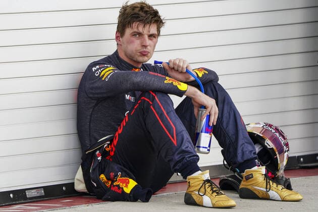 Dutch Formula One driver Max Verstappen of Red Bull Racing takes a rest and a drink after winning the Formula One Grand Prix of Miami at the Miami International Autodrome in Miami Gardens, Florida, on Sunday, May 8, 2022.  MIA20220508210 SHAWNxTHEW