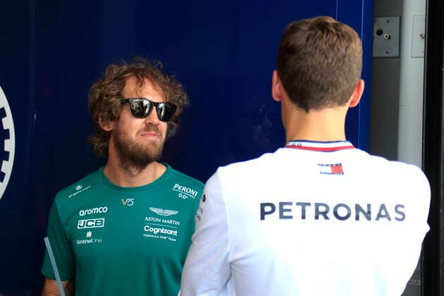 MIAMI GARDENS, FL - MAY 08: Aston Martin Aramco Cognizant driver Sebastian Vettel (5) of Germany talks Mercedes-AMG Petronas driver George Russell (63) of Great Britain during the parade of drivers prior to the Formula 1 CRYPTO.COM Miami Grand Prix on May 8, 2022 at Miami International Autodrome in Miami Gardens, FL.(Photo by Jeff Robinson Icon Sportswire) AUTO: MAY 08 F1 Crypto.com Miami Grand Prix Icon22050812171