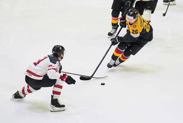 Samuel Soramies Nr.26 of Germany compete, fight for the puck against, Dysin Mayo Nr. 61 of Canada in the match GERMANY - CANADA IIHF Ice hockey, Eishockey World Championship, WM, Weltmeisterschaft Group B in Helsinki, Finland, May 13, 2022, Season 2021 2022