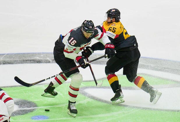 Marc MICHAELIS Nr.65 of Germany compete, fight for the puck against, Morgan Geekie Nr. 16 of Canada in the match GERMANY - CANADA IIHF Ice hockey, Eishockey World Championship, WM, Weltmeisterschaft Group B in Helsinki, Finland, May 13, 2022, Season 2021 2022