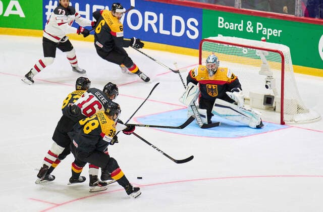 Fabio Wagner Nr.38 of Germany goalie Philipp GRUBAUER Goalie Nr.30 of Germany compete, fight for the puck against, Morgan Geekie Nr. 16 of Canada in the match GERMANY - CANADA IIHF Ice hockey, Eishockey World Championship, WM, Weltmeisterschaft Group B in Helsinki, Finland, May 13, 2022, Season 2021 2022