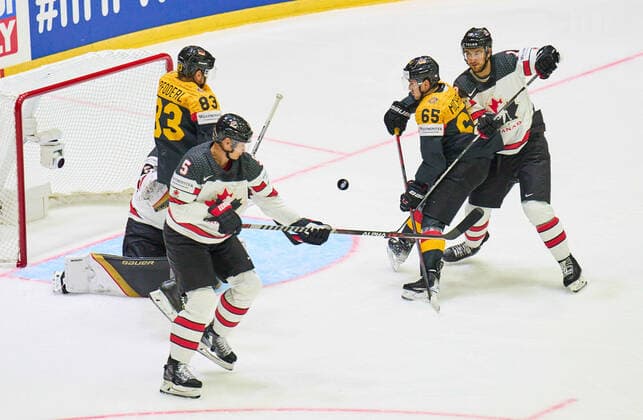 Marc MICHAELIS Nr.65 of Germany Leonard Leo Pföderl 83 of Germany compete, fight for the puck against, Nicholas Holden Nr. 5 of Canada Nicolas Roy Nr. 10 of Canada in the match GERMANY - CANADA IIHF Ice hockey, Eishockey World Championship, WM, Weltmeisterschaft Group B in Helsinki, Finland, May 13, 2022, Season 2021 2022