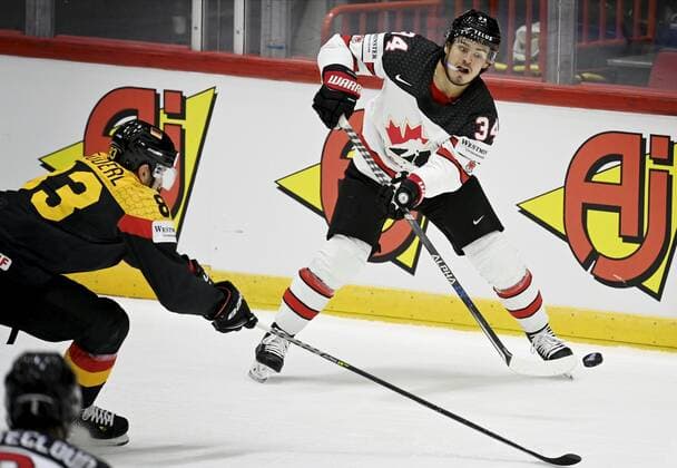 Leonhard Pfoderl of Germany and Cole Sillinger of Canada during the 2022 IIHF Ice hockey, Eishockey World Championships preliminary round group A match between Germany and Canada in Helsinki on May 13th, 2022. Helsinki Finland LKLAPA20220513204001C691  Copyright: xAnttixAimo-Koivistox