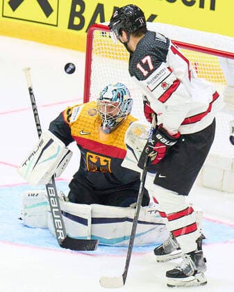 goalie Philipp GRUBAUER Goalie Nr.30 of Germany compete, fight for the puck against, Adam Lowry Nr. 17 of Canada in the match GERMANY - CANADA IIHF Ice hockey, Eishockey World Championship, WM, Weltmeisterschaft Group B in Helsinki, Finland, May 13, 2022, Season 2021 2022