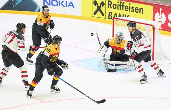 goalie Philipp GRUBAUER Goalie Nr.30 Korbinian Holzer Nr.5 of Germany Fabio Wagner Nr.38 of Germany of Germany compete, fight for the puck against, Adam Lowry Nr. 17 of Canada in the match GERMANY - CANADA IIHF Ice hockey, Eishockey World Championship, WM, Weltmeisterschaft Group B in Helsinki, Finland, May 13, 2022, Season 2021 2022